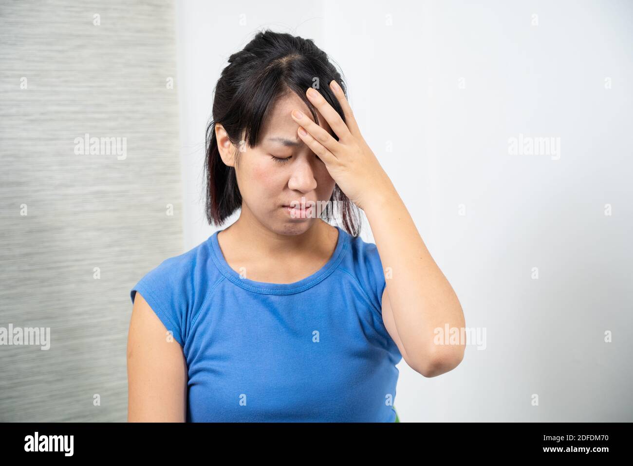 Asian woman having headache. Stock Photo