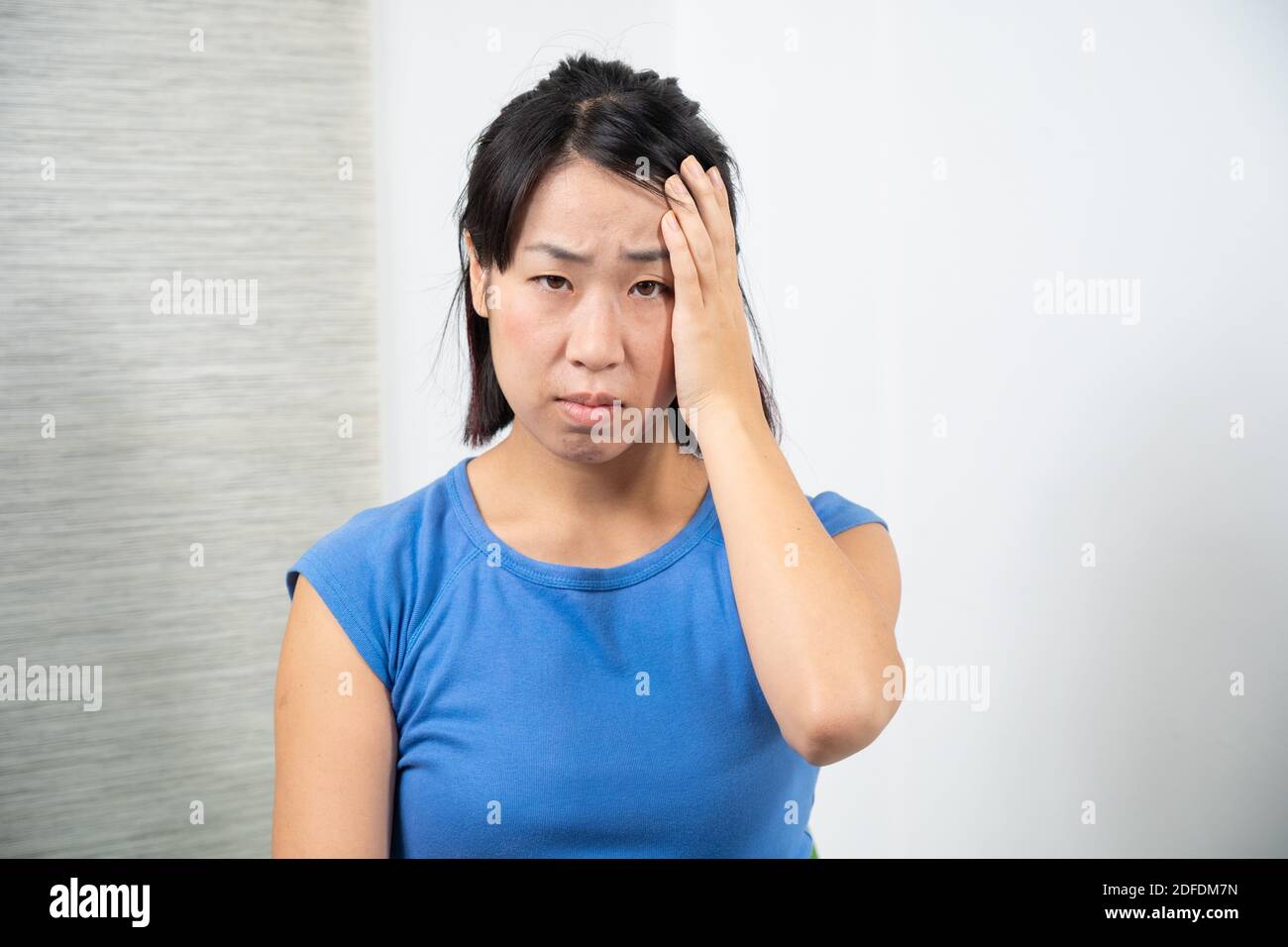 Asian woman having headache. Stock Photo