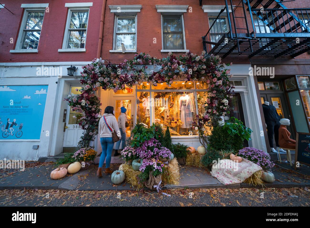 Beautiful Halloween decorations at storefront in West Village NYC Stock