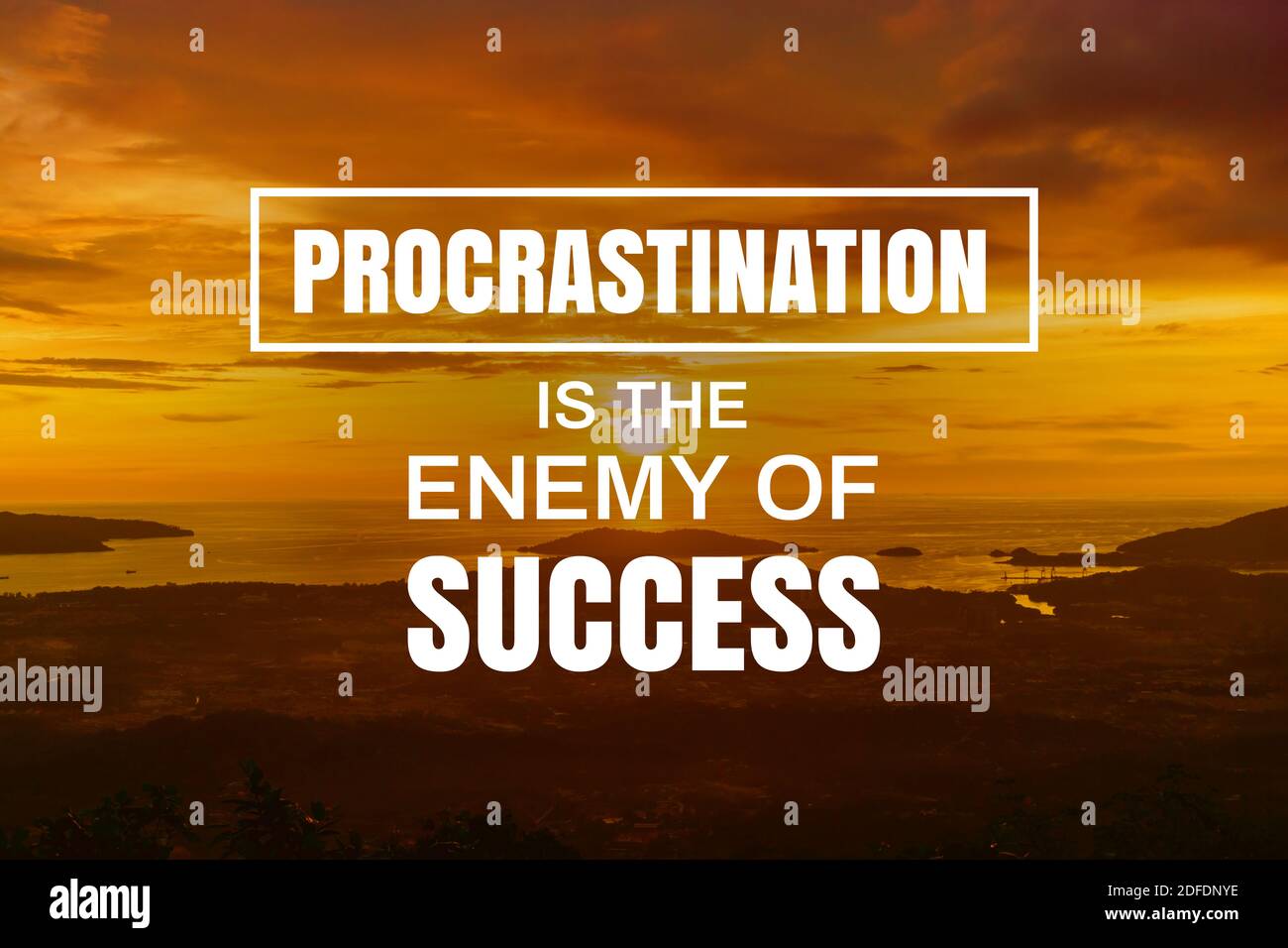 Inspirational and Motivational Quote. Procrastination is The Enemy of Success. Sunset Background. Stock Photo