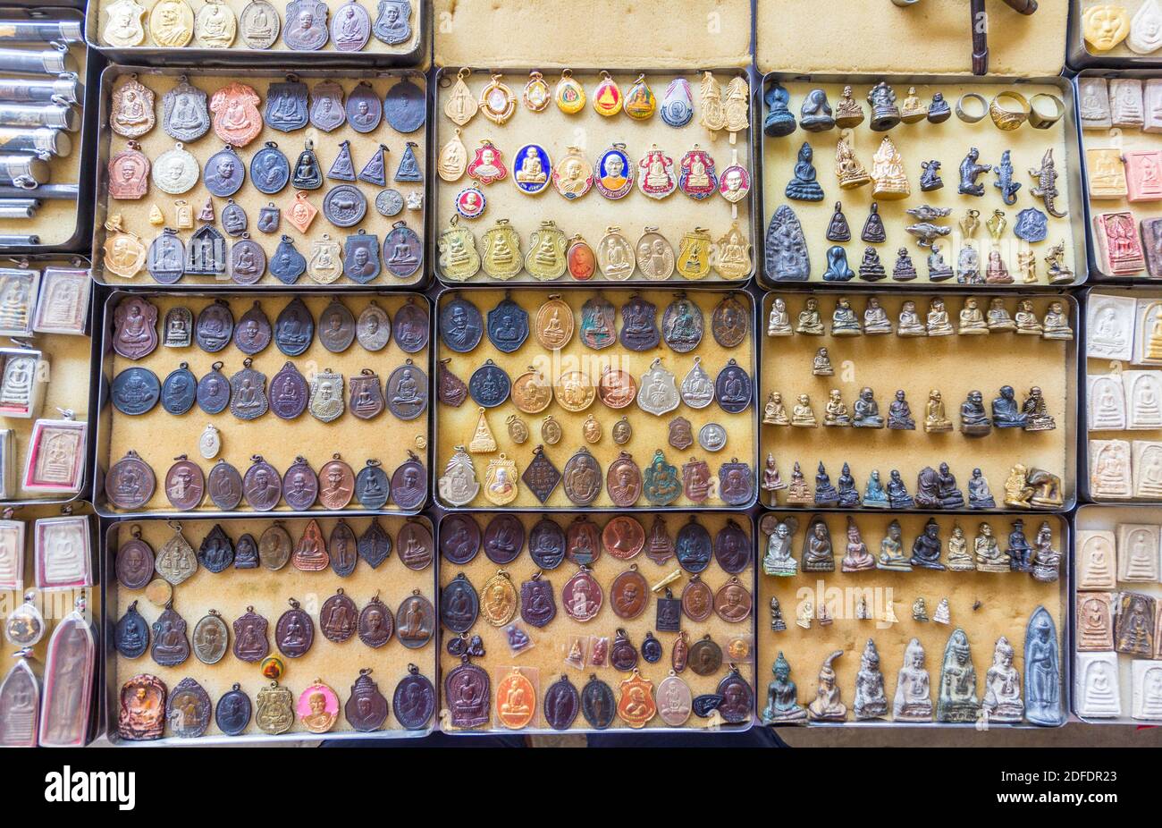 Buddhist amulets on sale outside a temple in Phetchaburi, Thailand Stock Photo