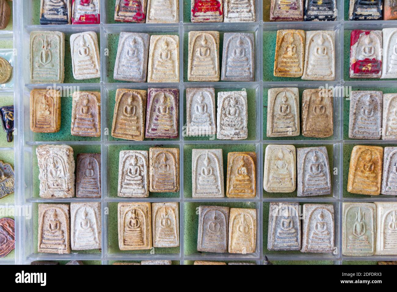 Buddhist amulets on sale outside a temple in Phetchaburi, Thailand Stock Photo