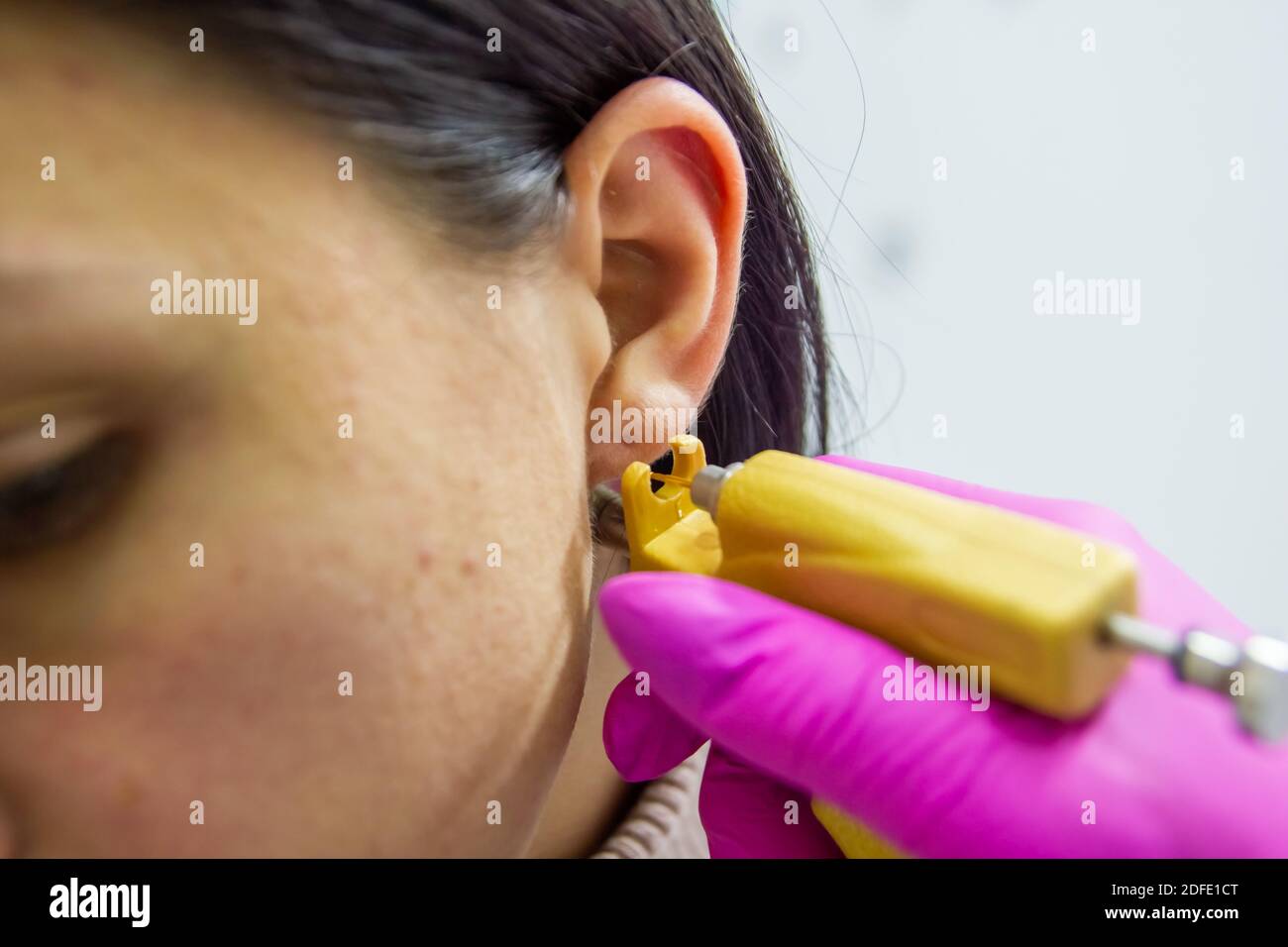 Ear piercing hires stock photography and images Alamy