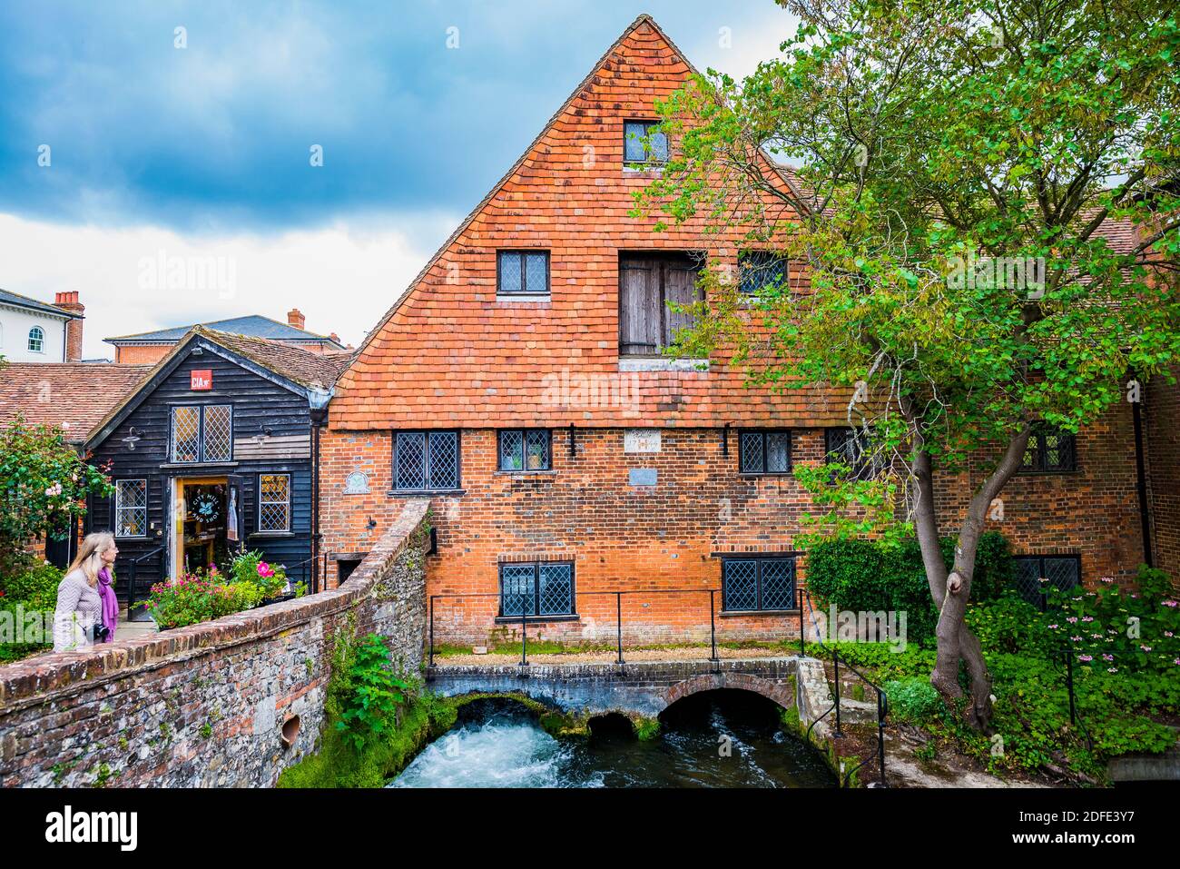 Photo taken outside the enclosure. Winchester City Mill, on the River Itchen, last rebuilt in 1744. Winchester, Hampshire, England, United Kingdom Stock Photo