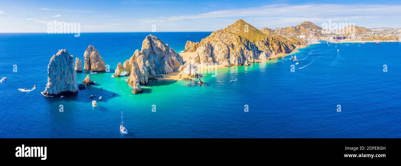 Aerial panoramic view of Lands End and El Arco at the tip of Baja California Sur, with the Cabo San Lucas, Mexico marina in the background Stock Photo