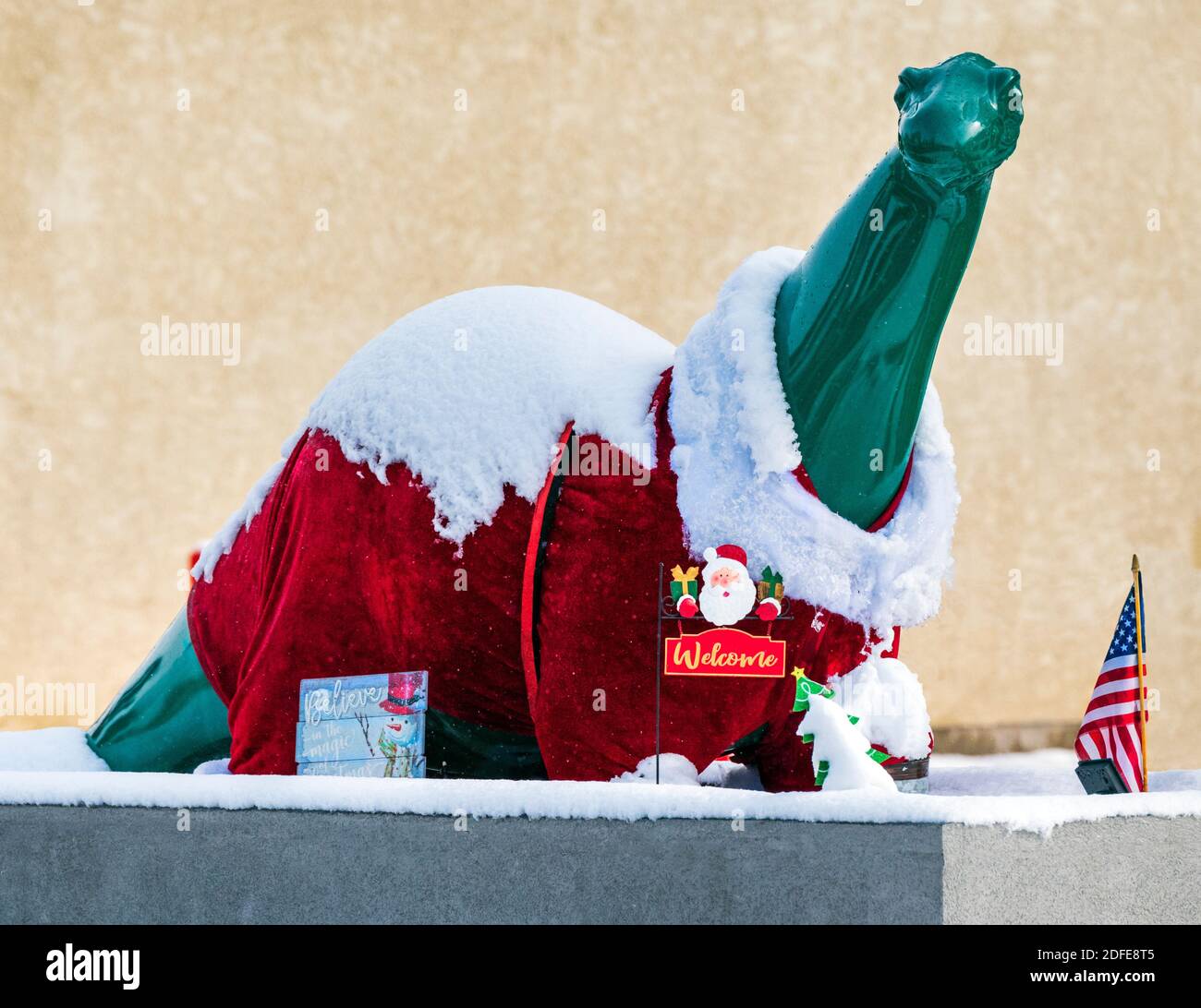 Dino, the Sinclair Oil dinosaur icon, decorated for Christmas at Sinclair gas station; Salida; Colorado; USA Stock Photo