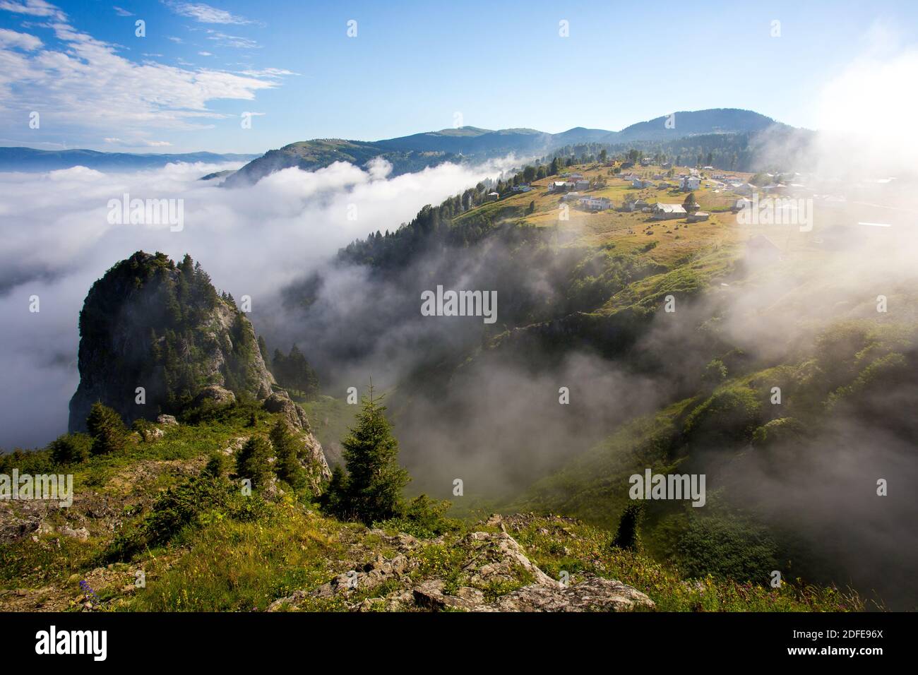 The famous Hidirlik Hill in Trabzon's Akcaabat district. The mist rises from the deep and covers the plateau. Morning hours.Akcaabat,Trabzon. Stock Photo