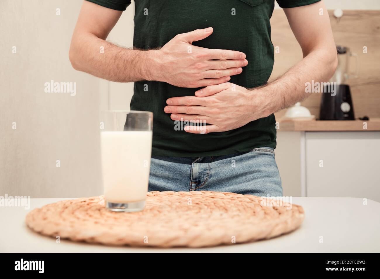 Man feels bad, lactose intolerance. Dairy intolerant person. Health