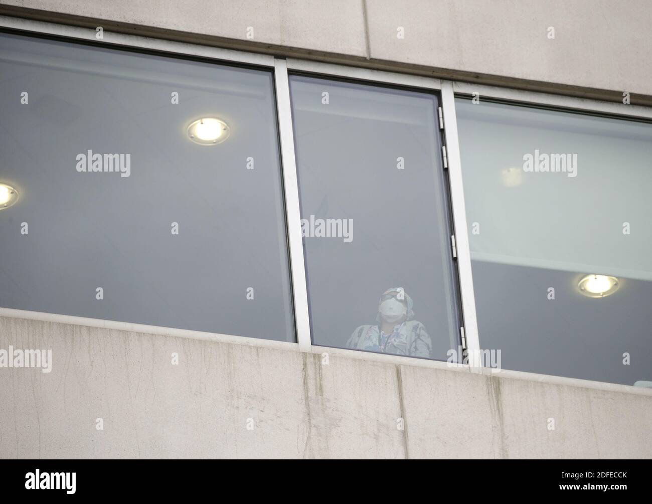 Brooklyn, United States. 04th Dec, 2020. A medial worker wearing PPE stands at a window at Maimonides Medical Center in New York City on Friday, December 4, 2020. The number of Americans hospitalized with COVID-19 in the United States was again over 100,000 on Thursday. Photo by John Angelillo/UPI Credit: UPI/Alamy Live News Stock Photo