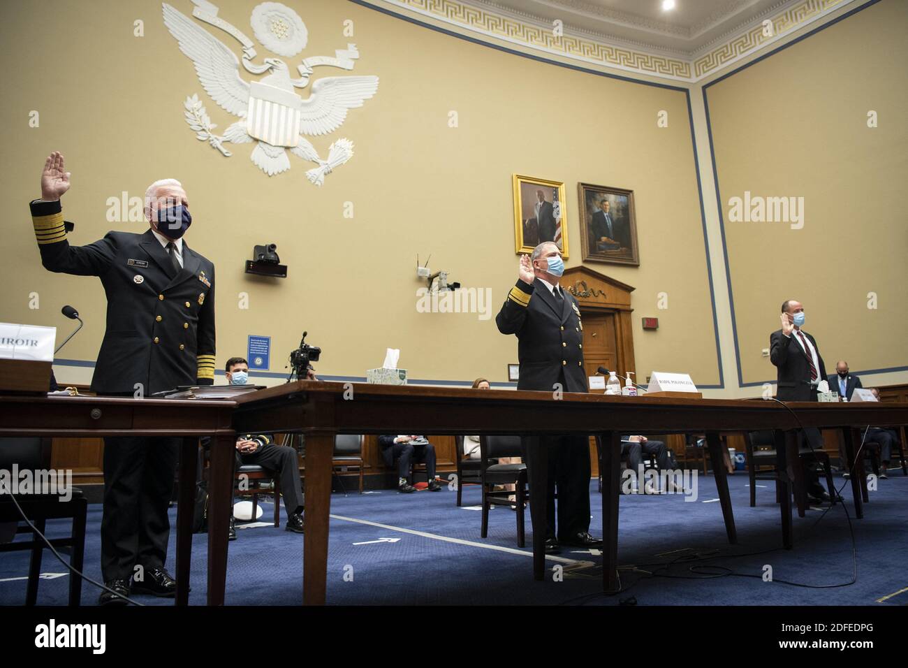 UNITED STATES - JULY 2: Admiral Brett P. Giroir, M.D., Assistant Secretary for Health, left, Rear Adm. John Polowczyk, leader of the Supply Chain Stabilization Task Force and vice director of logistics of the Joint Chiefs of Staff, and Kevin Fahey, assistant Defense secretary for acquisition, swear in before testifying during a House Oversight and Reform Committee hearing on âÂ€ÂœThe Administration's Efforts to Procure, Stockpile, and Distribute Critical SuppliesâÂ€Â in the Capitol in Washington on Thursday, July 2, 2020. Photo by Caroline Brehman/Pool/ABACAPRESS.COM Stock Photo