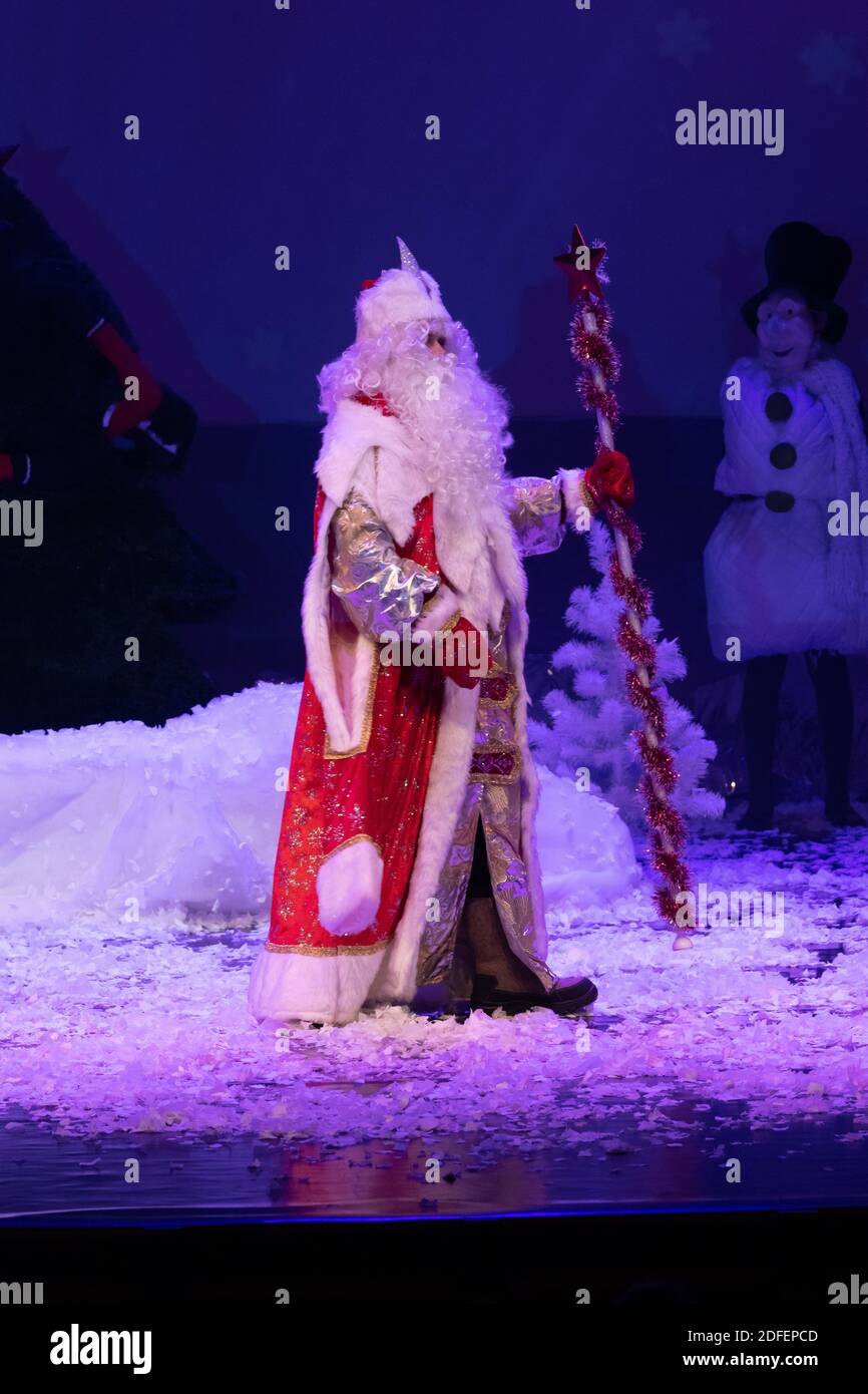 Emotional Santa Claus with a long white beard in a red coat and white ...