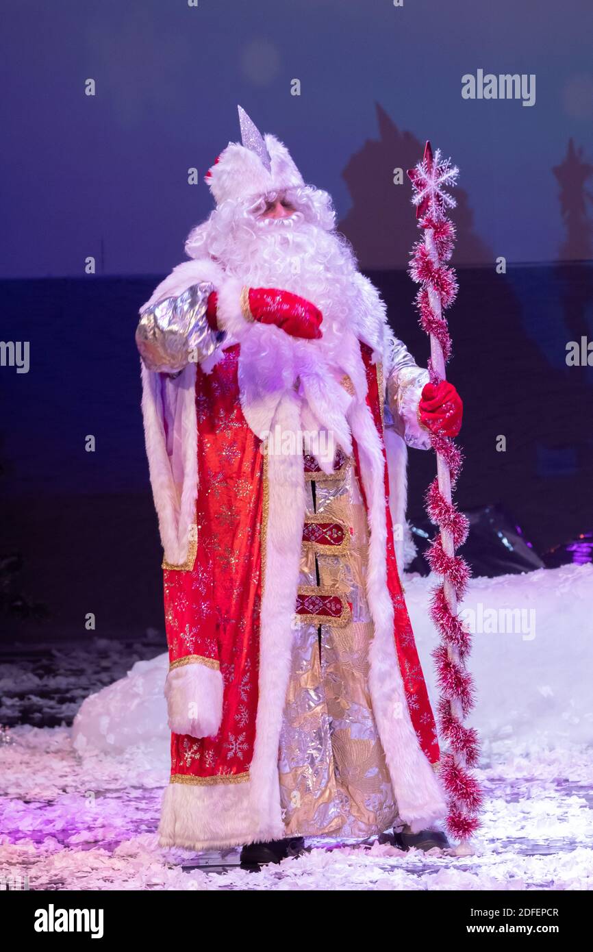 Emotional Santa Claus with a long white beard in a red coat and white ...