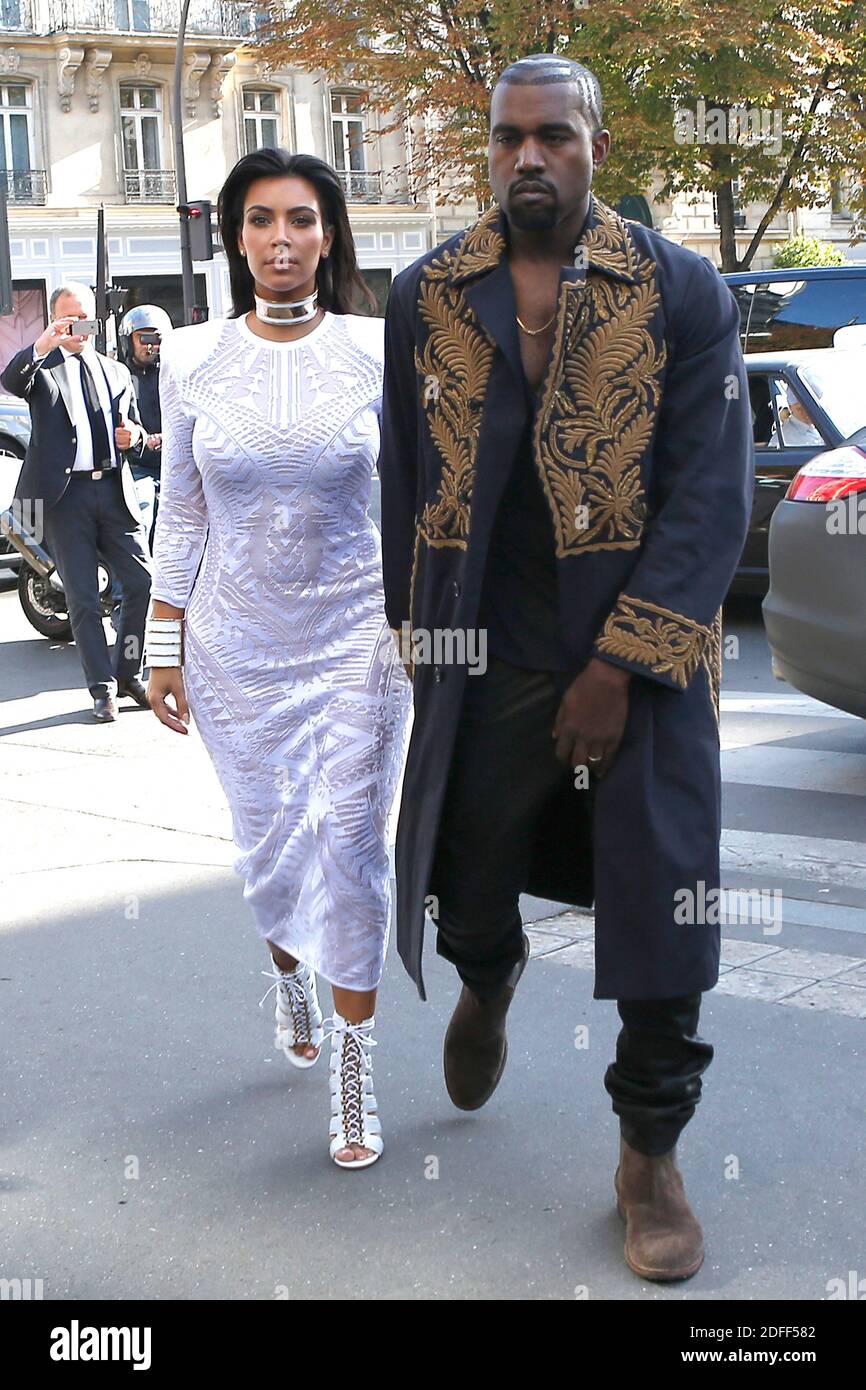 File photo of Kim Kardashian and husband Kanye West are seen at L'Avenue restaurant where they had lunch with Kris Jenner and Kendall Jenner during the Paris Fashion Week, in Paris, France on September 25, 2014. Kim Kardashian West spoke out about Kanye West's bipolar disorder Wednesday, three days after the rapper delivered a lengthy monologue at a campaign event touching on topics from abortion to Harriet Tubman, and after he said he has been trying to divorce her.Kardashian West said in a statement posted in an Instagram Story that she has never spoken publicly about how West's bipolar diso Stock Photo