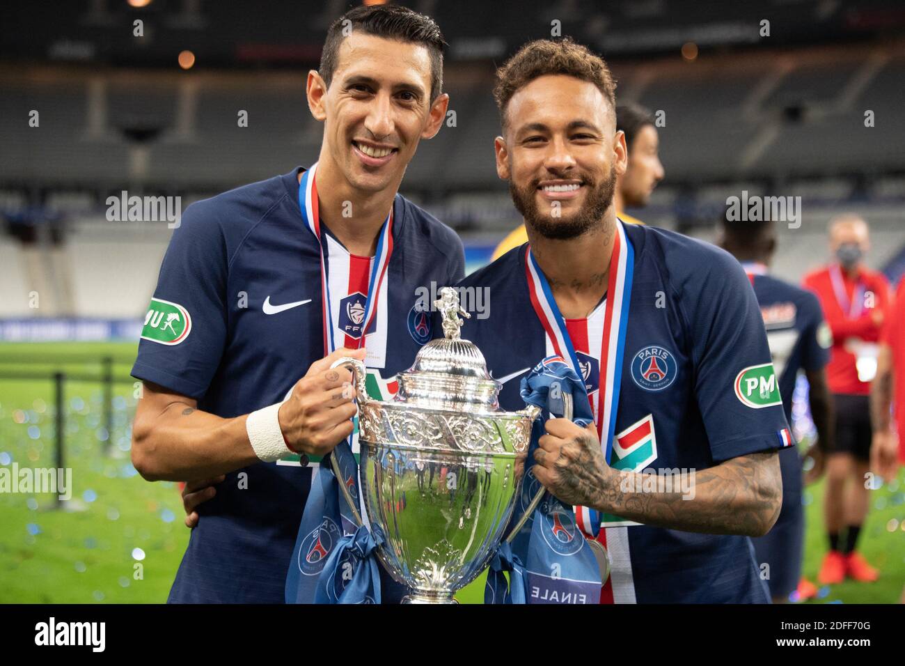 Paris Saint Germain's Neymar with Angel Di Maria celebrate with the trophy  after winning the French Cup during the Final between AS Saint-Etienne and  Paris Saint Germain at Stade de France on