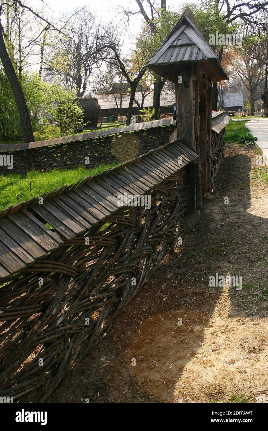 Beautiful wattle fence and wooden gate exhibited at the Village Museum in Bucharest, Romania Stock Photo