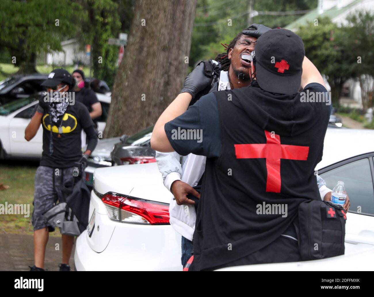 NO FILM, NO VIDEO, NO TV, NO DOCUMENTARY - A counter protestor gets his eyes washed out after a protestor sprayed him with bug spray as several far-right groups, including militias and white supremacists, rally on Saturday, Aug. 15, 2020. Photo by Alyssa Pointer/Atlanta Journal-Constitution/TNS/ABACAPRESS.COM Stock Photo