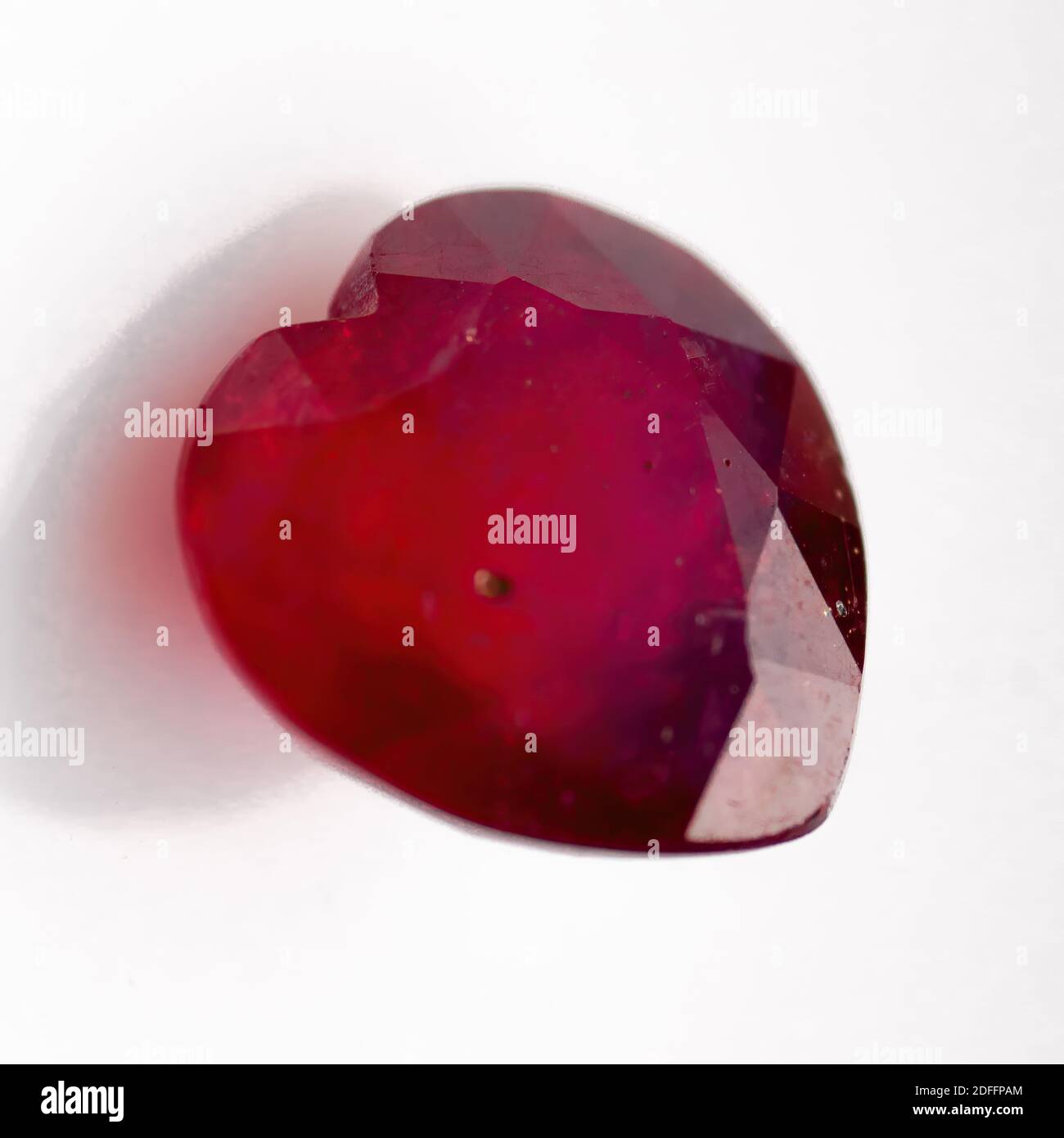 Natural ruby in the shape of a heart on a white background Stock Photo ...