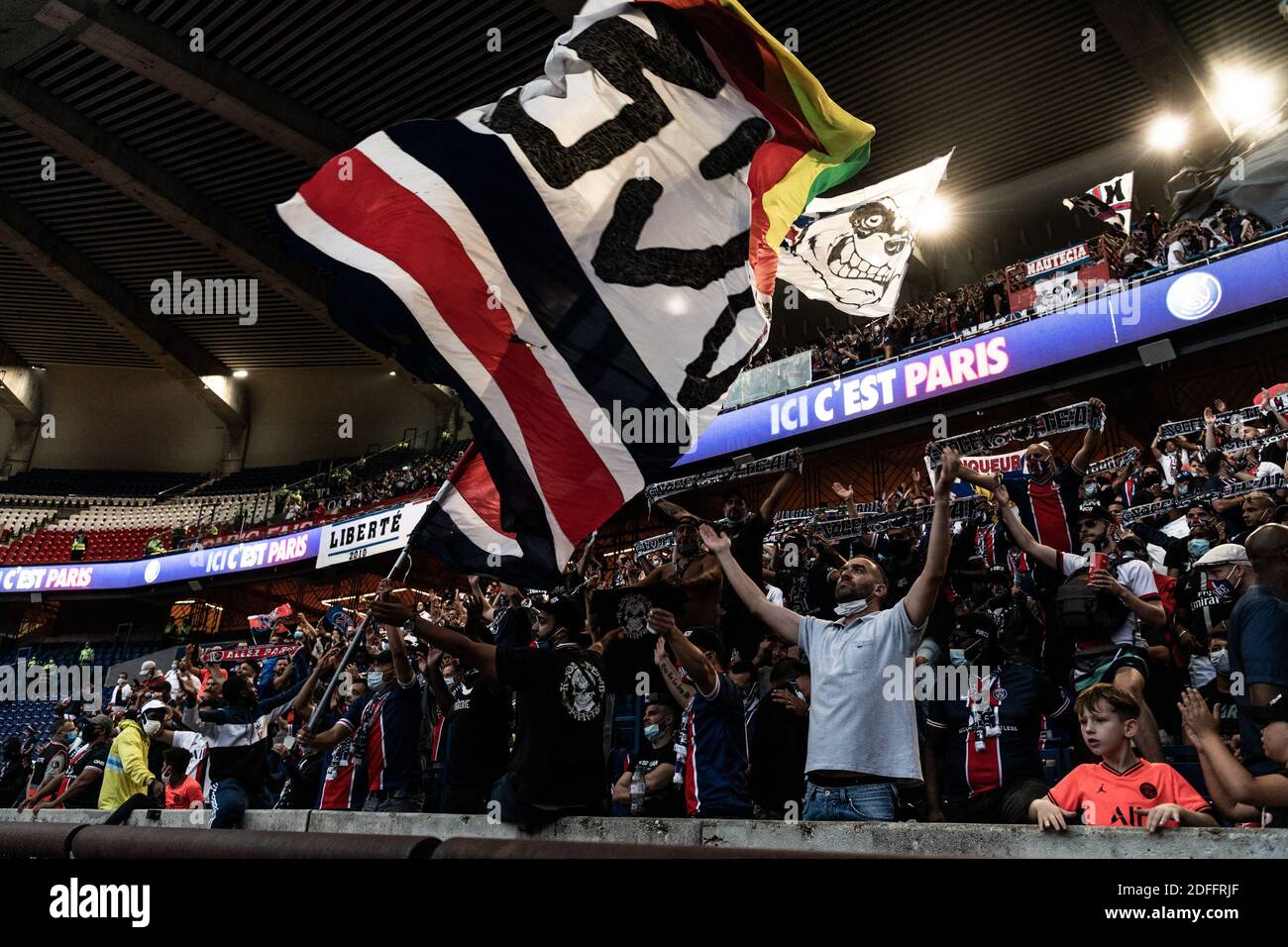 Paris Saint-Germain (PSG) supporters cheer for their team as they watch ...