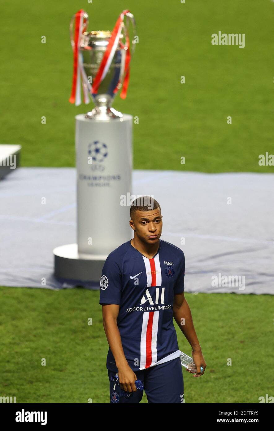 Handout - Editorial Use Only. : Kylian Mbappe of Paris Saint-Germain looks  dejected as he walks past the UEFA Champions League Trophy after the UEFA Champions  League Final match between Paris Saint-Germain