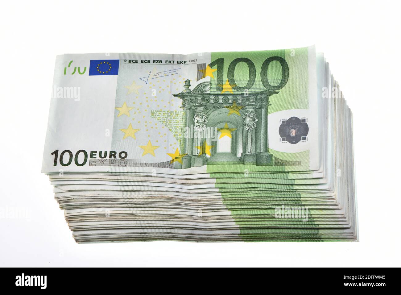 a pile of 10,000 euros in one hundred 100 euro banknotes isolated on white background Stock