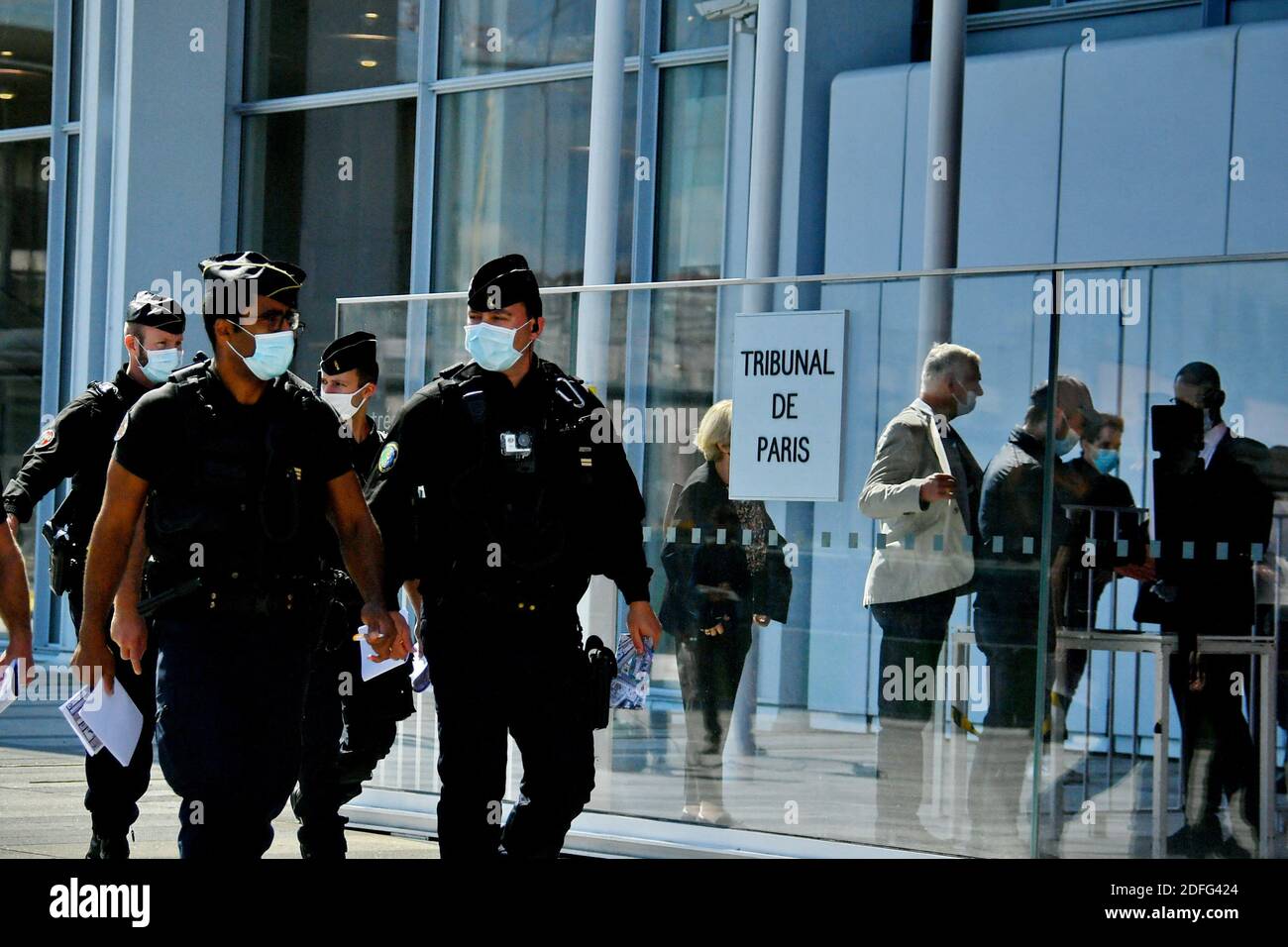 Policemen with weapons and masks pass in front of the High Court of Paris (TGI), Porte de Clichy, during the trial of the Charlie Hebdo, Montrouge and the Hyper Cacher opened this Wednesday, for two months, before the Special Assize Court of Paris. Judicial Court of Paris, on September 2, 2020. Photo by Karim Ait Adjedjou/Avenir Pictures/ABACAPRESS.COM Stock Photo