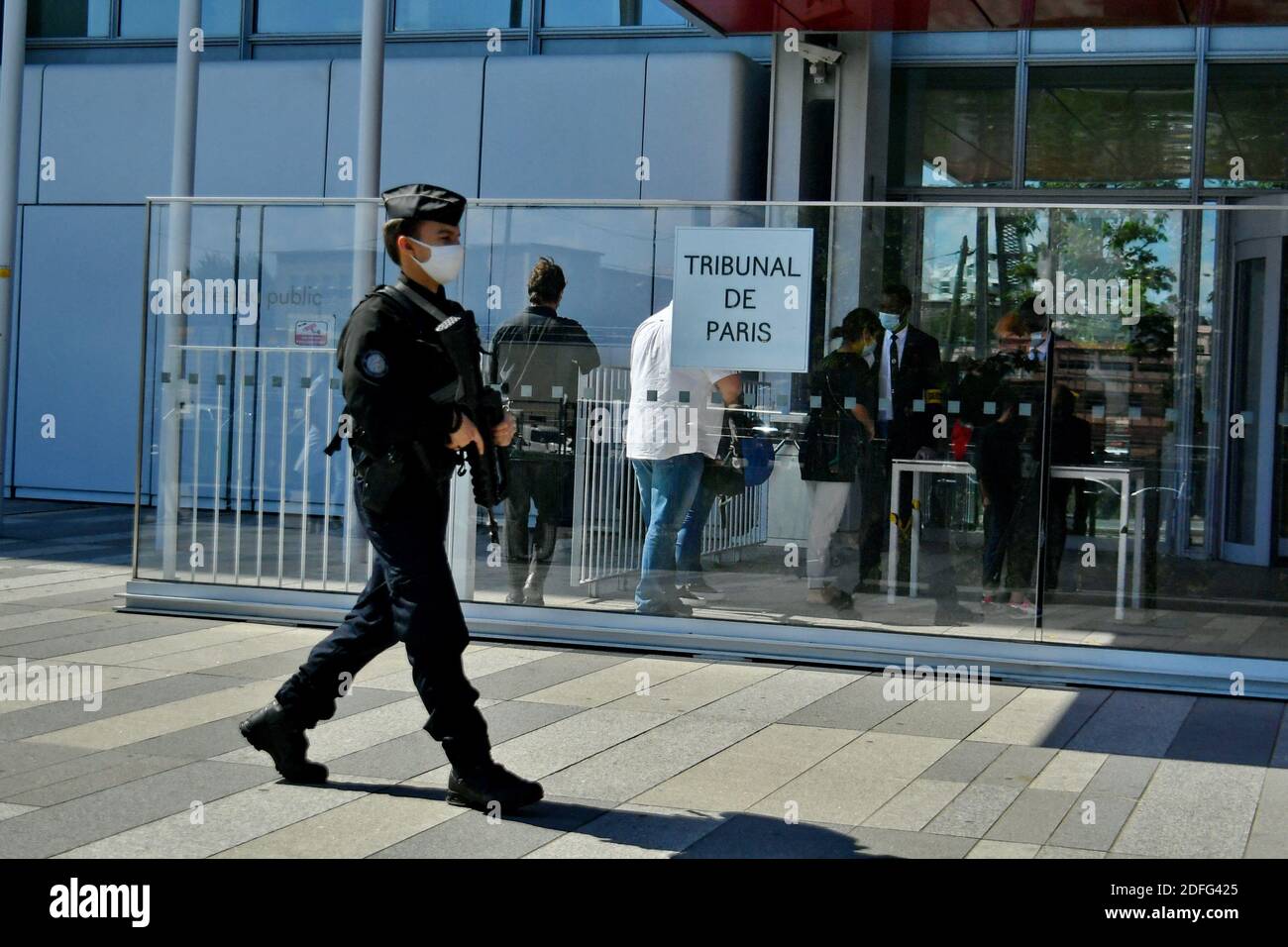 Policemen with weapons and masks pass in front of the High Court of Paris (TGI), Porte de Clichy, during the trial of the Charlie Hebdo, Montrouge and the Hyper Cacher opened this Wednesday, for two months, before the Special Assize Court of Paris. Judicial Court of Paris, on September 2, 2020. Photo by Karim Ait Adjedjou/Avenir Pictures/ABACAPRESS.COM Stock Photo