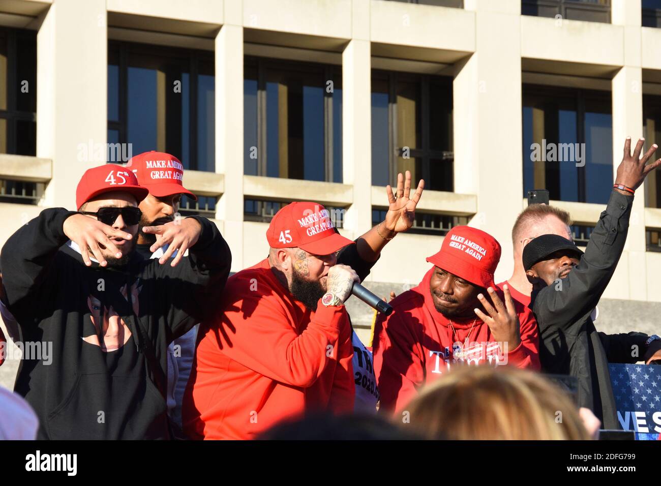 Washington DC. Nov 14, 2020. Million Maga March. Black rappers/singers for Trump singing music for Trump supporters holding up 4 fingers for 4 more yr Stock Photo