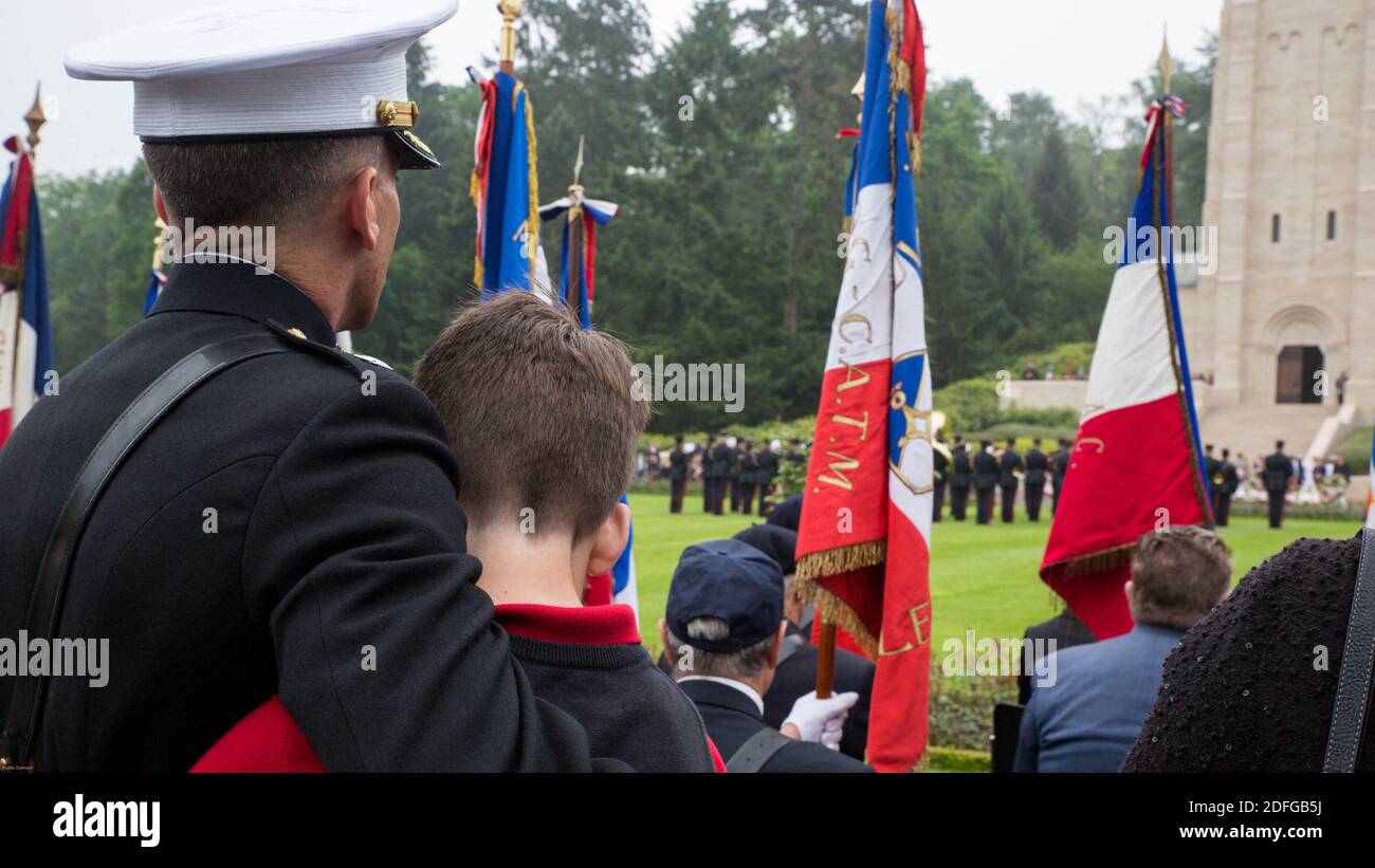 Hand out file photo dated May 29, 2016 of A U.S. Marine Lt. Col. and his son enjoy the French Army band during a Memorial Day ceremony in which U.S. Marines performed alongside the French Army at the Aisne-Marne American Memorial Cemetery in Belleau, France. The French and the Americans gathered together, as they do every year, to honor those service members from both countries who have fallen in WWI, Belleau Wood and throughout history, fighting side by side. The Marines also remembered those they lost in the Battle of Belleau Wood 98 years ago. President Trump reportedly skipped his schedule Stock Photo