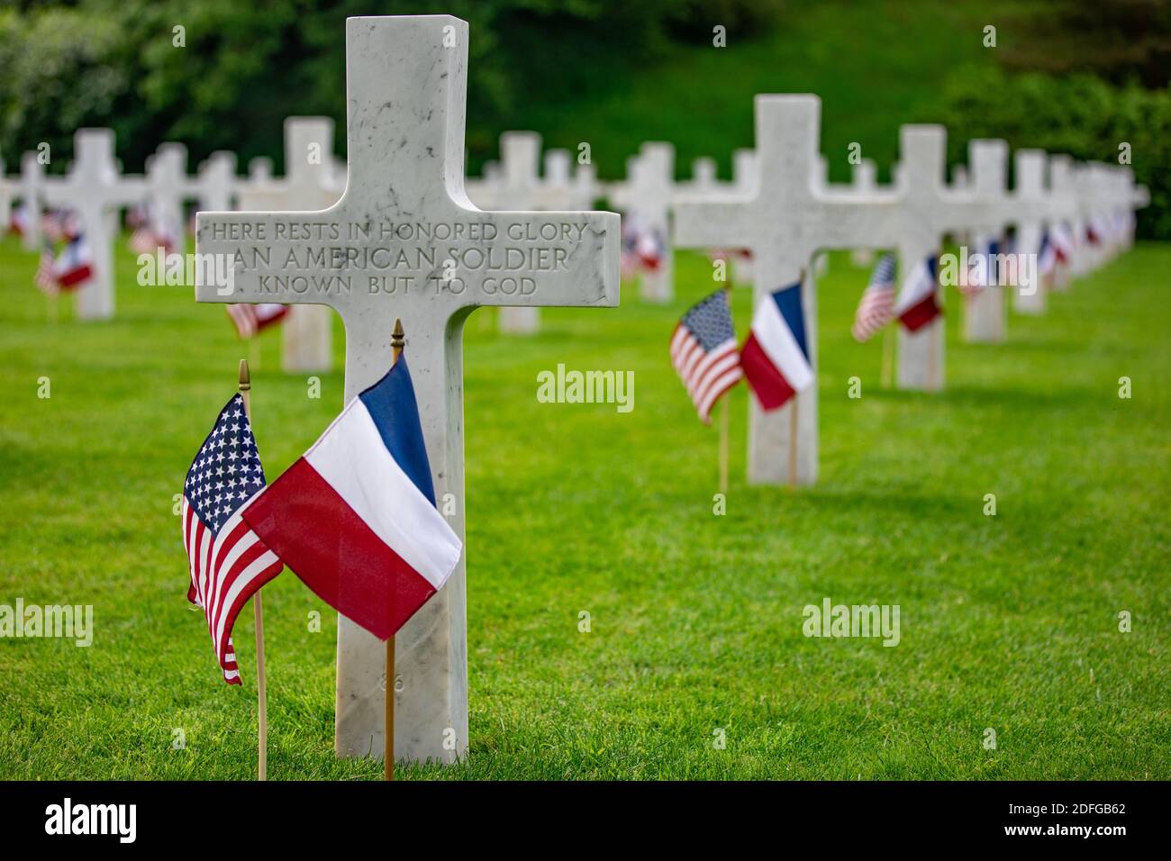 Hand out file photo dated May 26, 2019 of American and French flags wave in front of headstones at the Aisne-Marne Memorial near Belleau, France. The ceremony commemorated the 101st anniversary of the Battle of Belleau Wood, which marked the first occasion in World War I for U.S. forces to operate on a large scale against the German Army. President Trump reportedly skipped his scheduled visit to the Aisne-Marne American Cemetery near Paris in 2018 after dismissing the U.S. soldiers who died during the Battle of Belleau Wood as “losers.” According to a report in The Atlantic published Thursday, Stock Photo