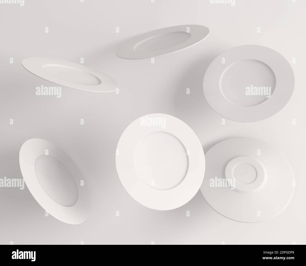 the multiple white plates in the air on a white background Stock Photo ...