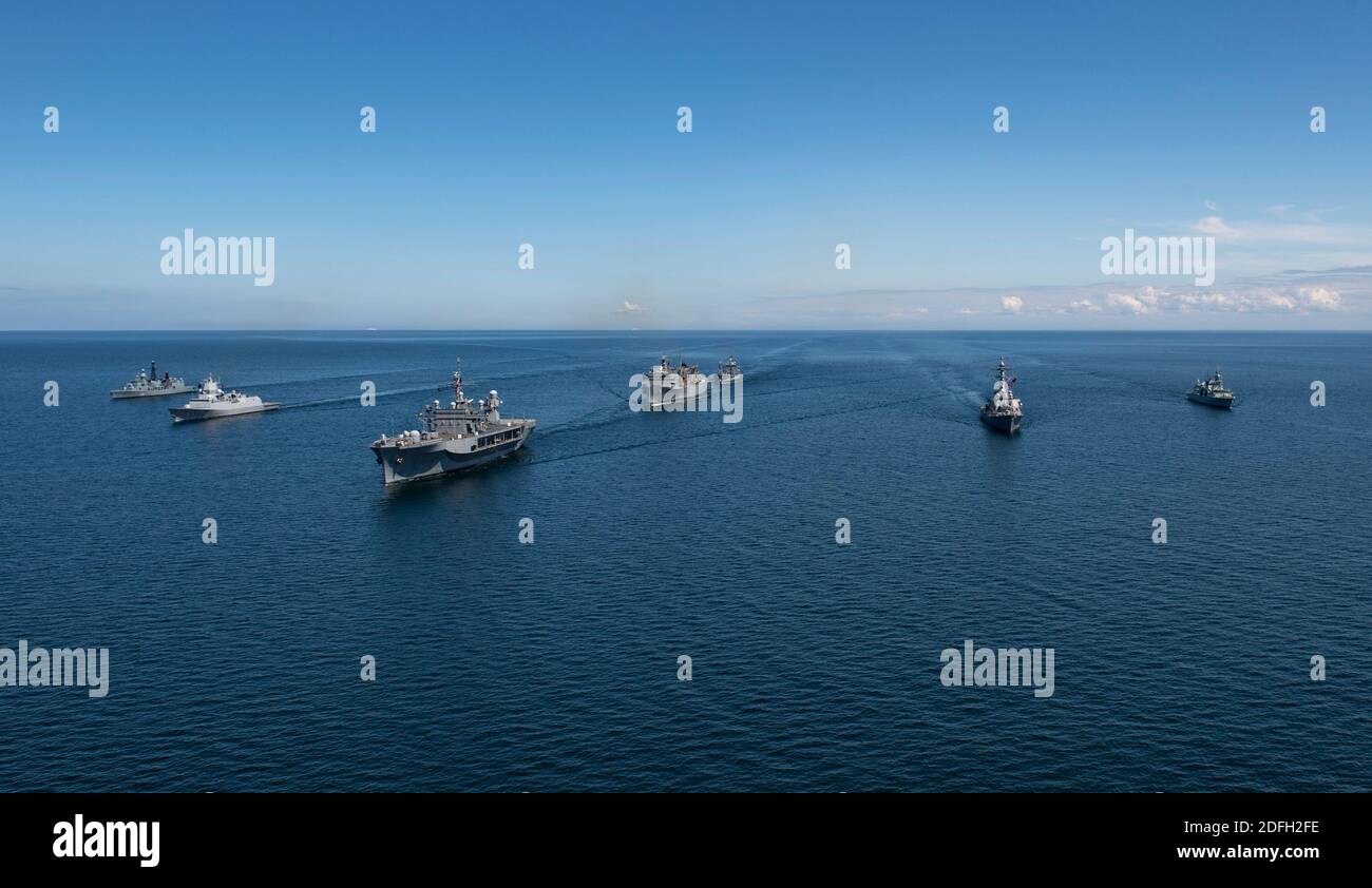 Handout file photo dated June 8, 2020 of ships from nations participating in exercise Baltic Operations (BALTOPS) 2020 sail in formation while in the Baltic Sea. The ships pictured are (in alphabetical order by home nation): the Royal Canadian Navy Halifax-class frigate HMCS Fredericton (FFH 337), the German navy Bremen-class frigate FGS Luebeck (F214), the German navy Rhoen-Class replenishment oiler FGS Rhoen (A1443), the Royal Norwegian Navy Fridtjof Nansen-class frigate HNoMS Otto Suerdrup (F312), the U.S. Navy Blue Ridge-class command and control ship USS Mount Whitney (LCC 20), the U.S. N Stock Photo