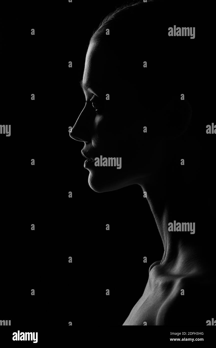 sad woman profile silhouette on black background looking down Stock Photo -  Alamy