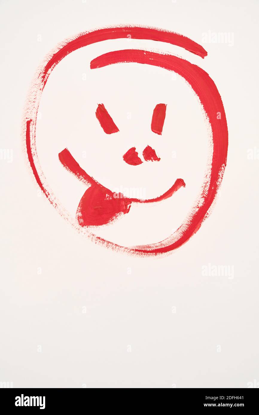 painted smiling face on white background, image with copy space Stock Photo