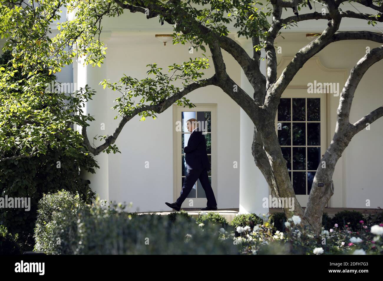 U.S. President Donald Trump walks out from the Oval Office of the White ...