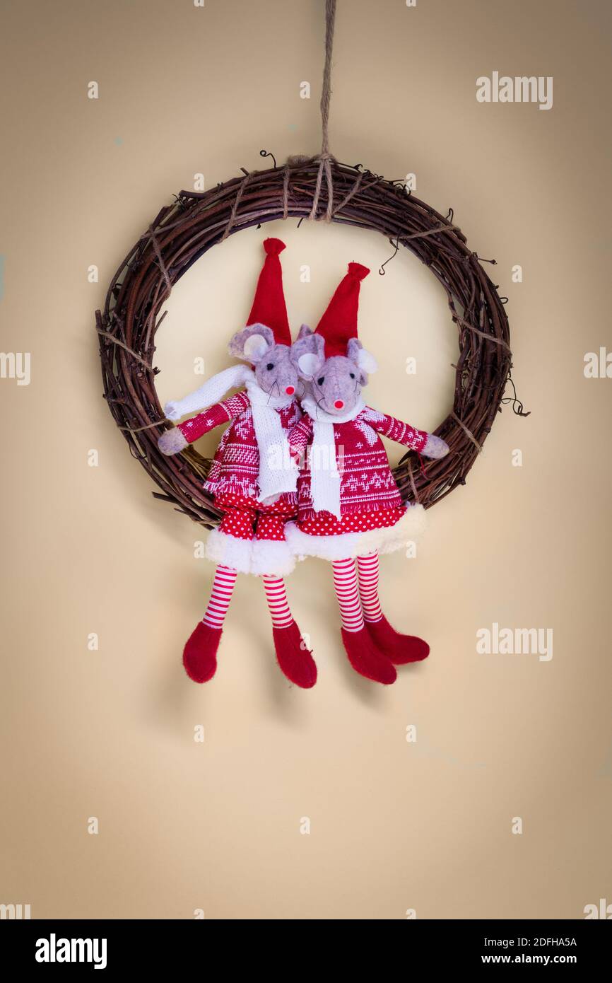 Two mice swinging on a Christmas wreath.Cute vintage decoration for Xmas holiday. Stock Photo