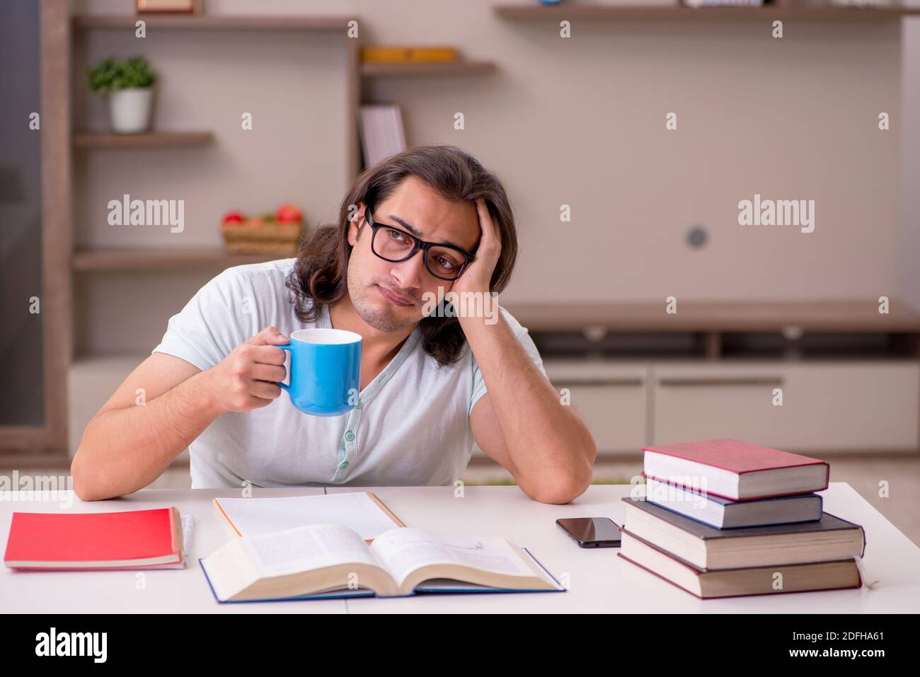 Young student preparing for exams at home Stock Photo