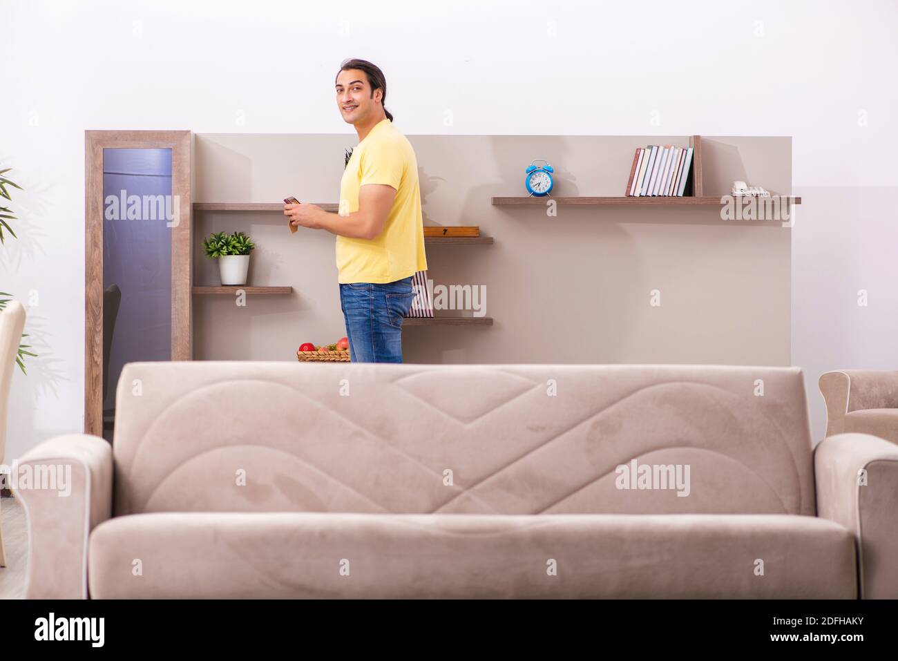 Young student boring at home during pandemic Stock Photo