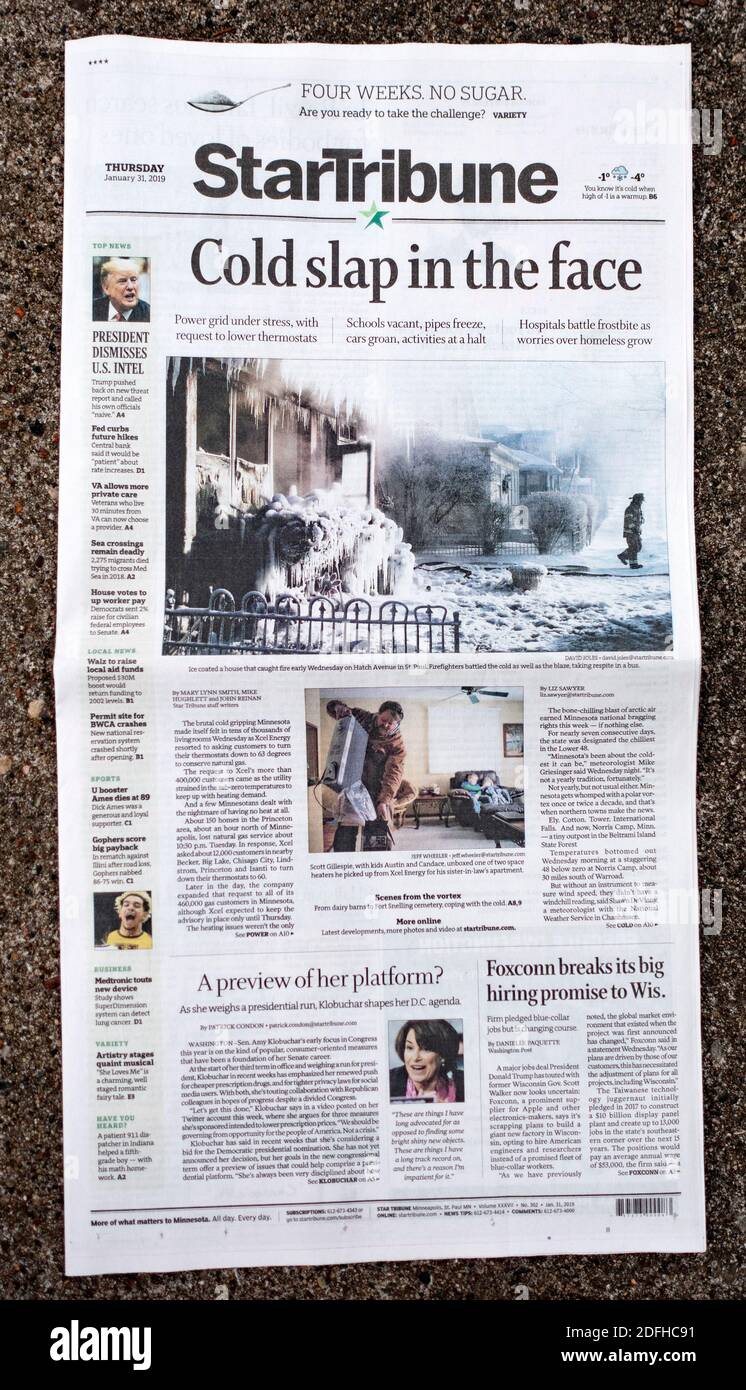 StarTribune Newspaper front page headline  discussing the freezing cold weather showing an iced covered house after a fire. St Paul Minnesota MN USA Stock Photo