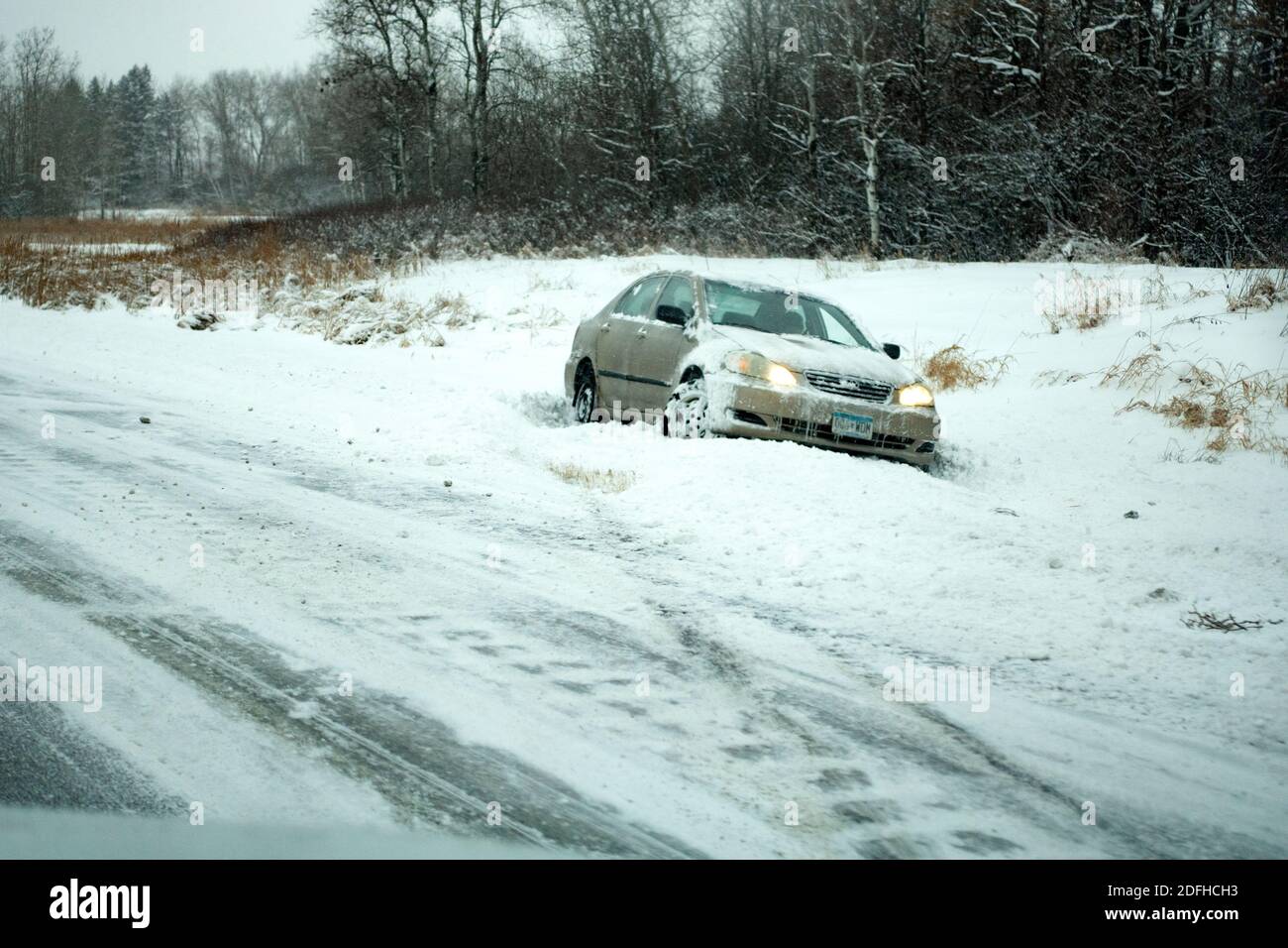 Car sliding on the ice into the ditch from I35 Freeway. Stacy