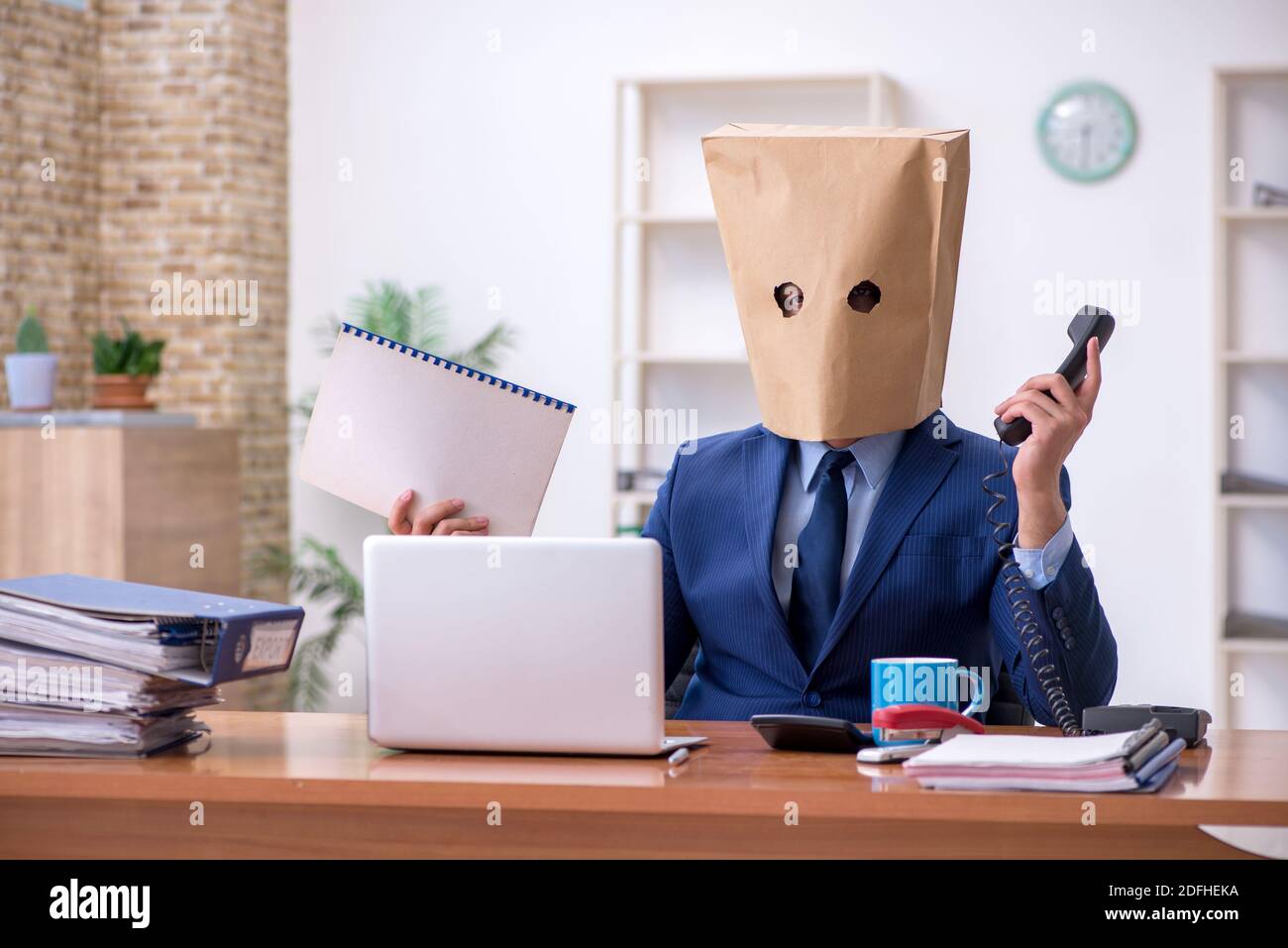 Male employee with box instead of his head Stock Photo