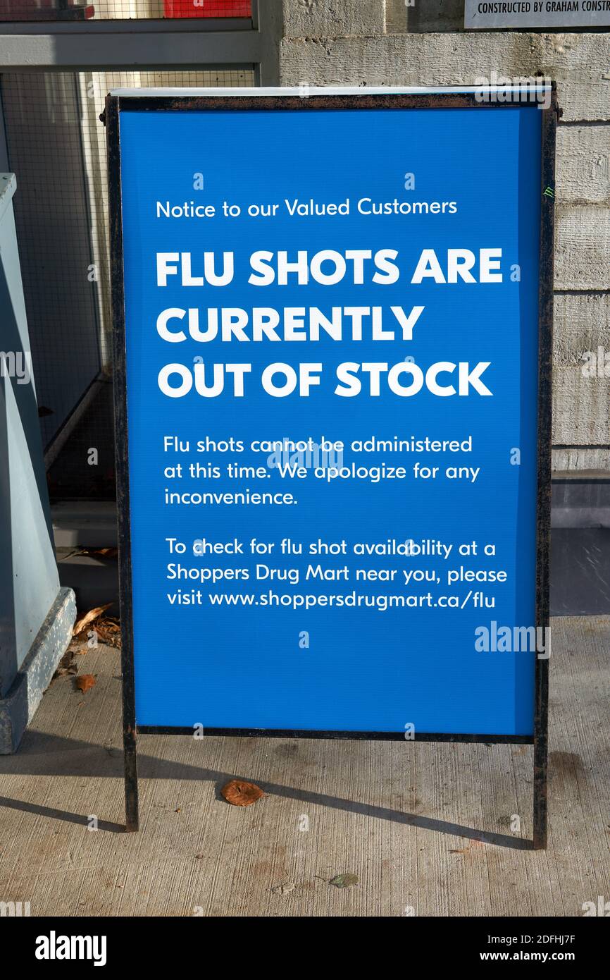 Vancouver, Canada. December 4, 2020. A sign outside a pharmacy in Vancouver, British Columbia, informs customers that flu shots are out of stock. This is due to heavy demand for flu vaccine during the COVID-19 pandemic that have led to shortages. Stock Photo
