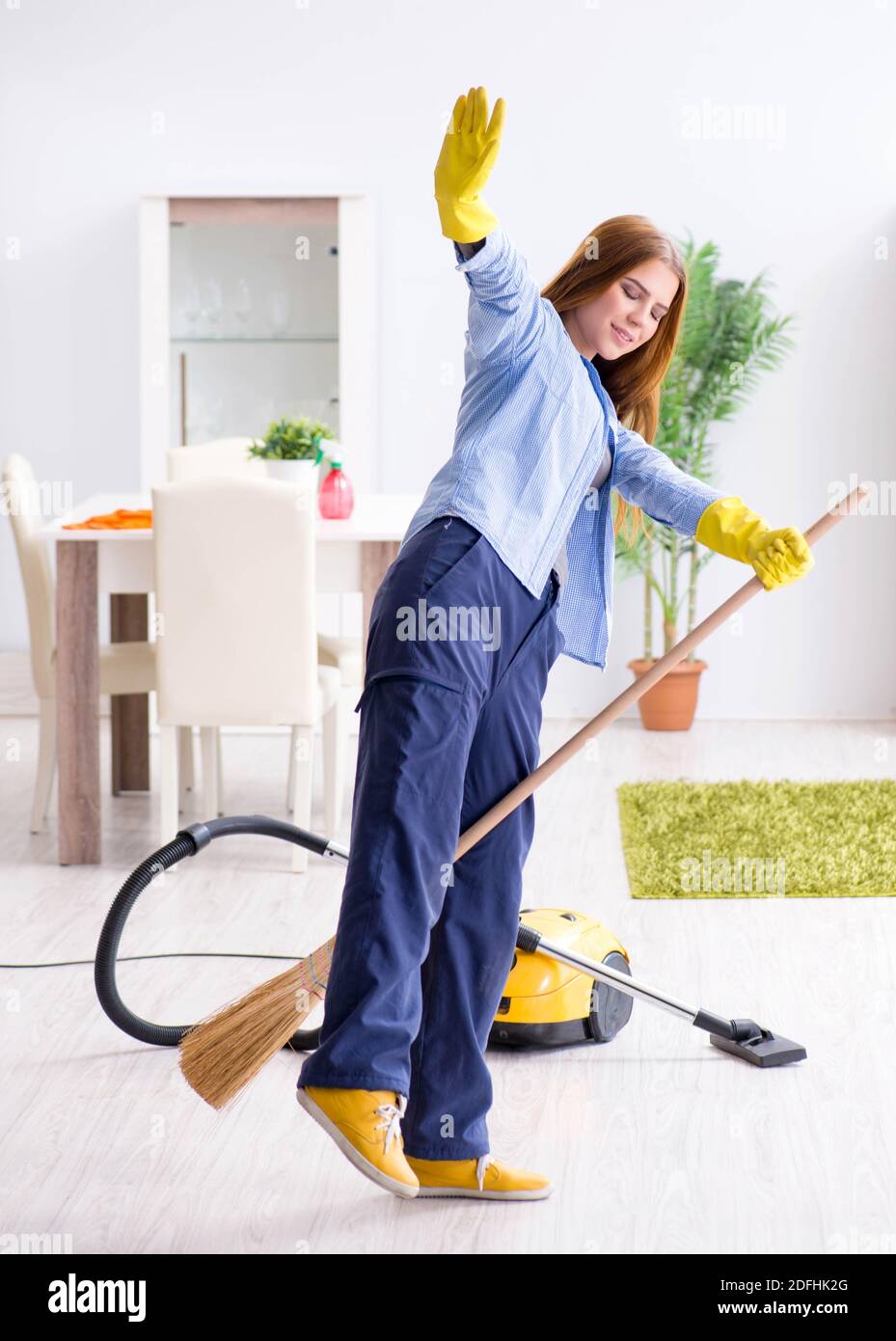 The young woman cleaning floor at home doing chores Stock Photo Alamy