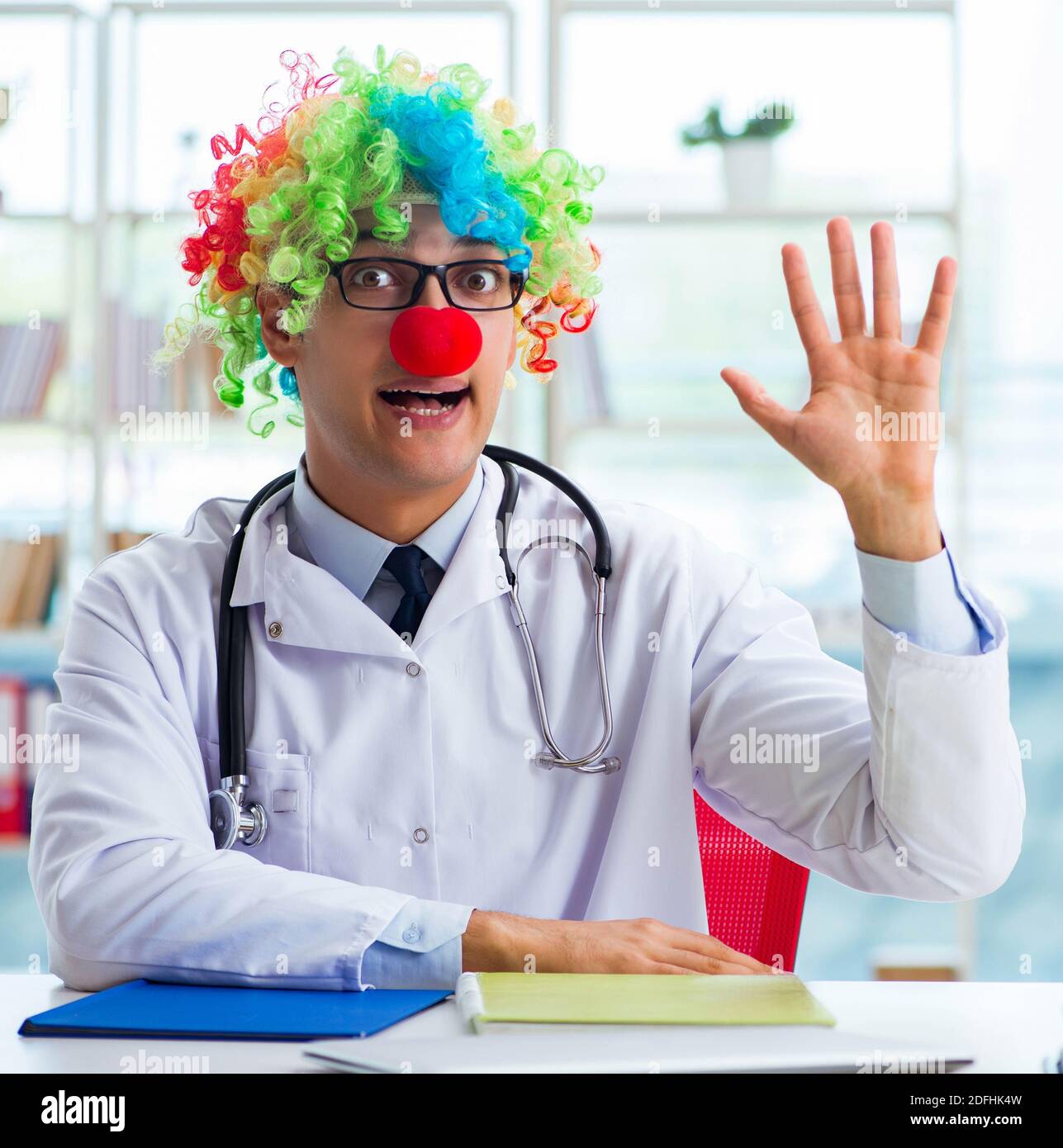 the-funny-pediatrician-with-clown-wig-in-the-hospital-clinic-2DFHK4W.jpg