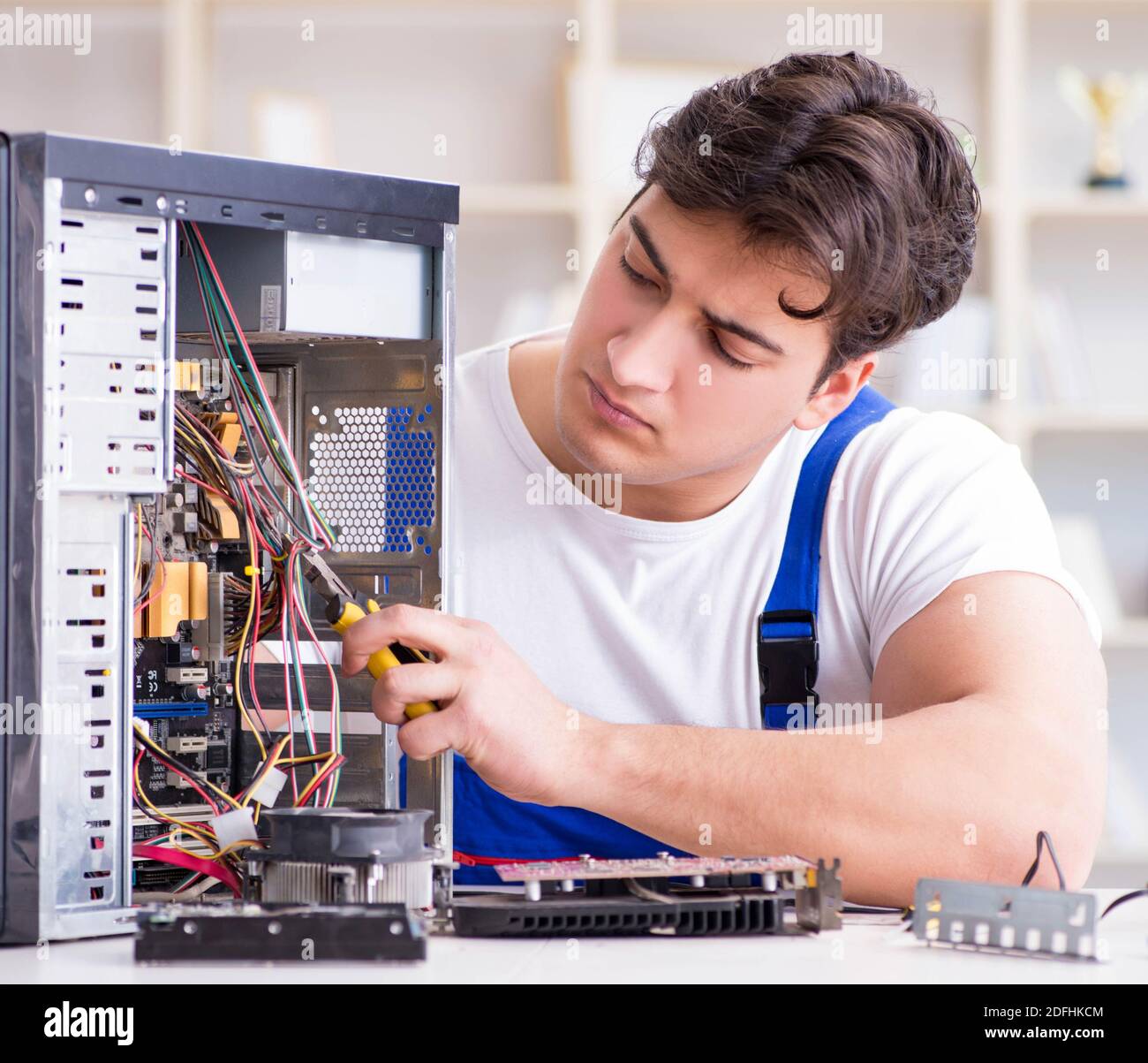 The computer repairman repairing desktop computer Stock Photo - Alamy