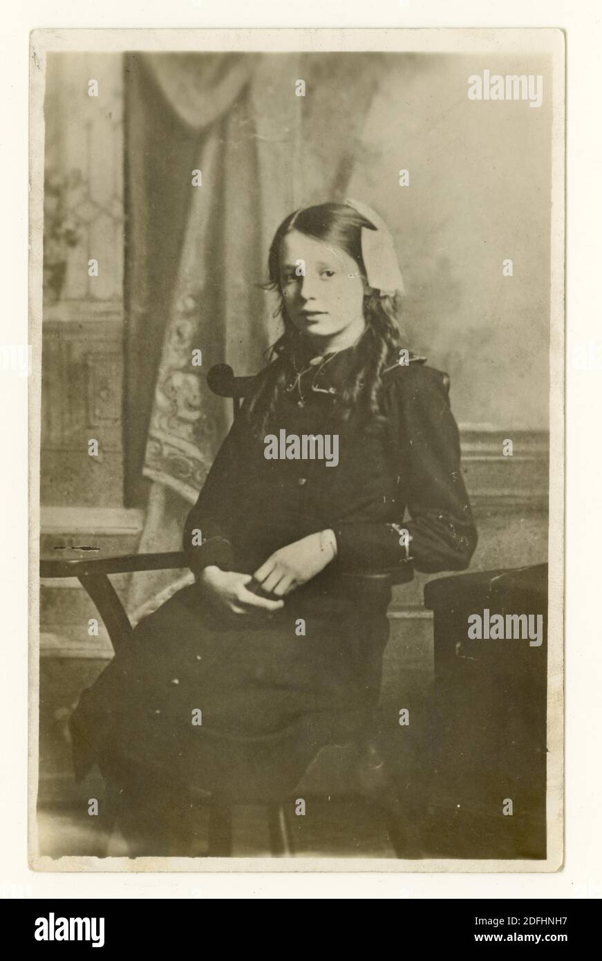 Original early 1900's WW1 era memorial postcard of a deceased girl called Minnie who was of teenage years when she died, dated January 1916, U.K. Stock Photo