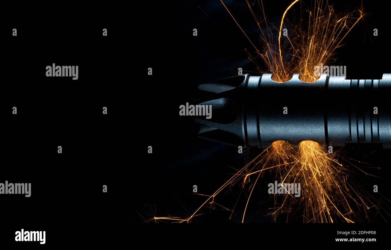 Sparks flying at the muzzle of a gun that's just been shot Stock Photo ...