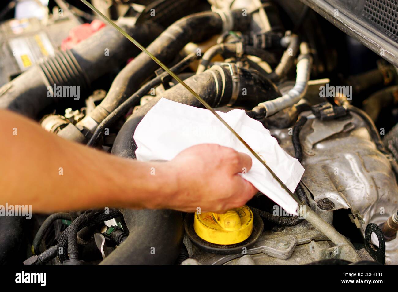 Check the oil level from the dipstick Stock Photo Alamy