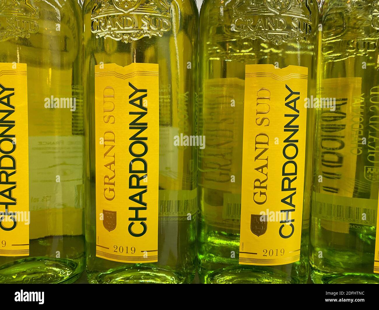 Viersen, Germany - May 9. 2020: Close up of bottles Chardonnay wine in shelf of german supermarket Stock Photo