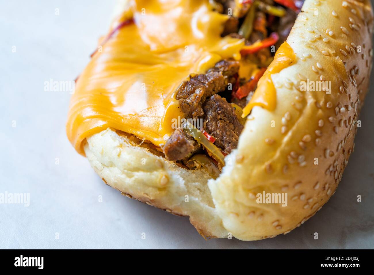 Philly Cheese Steak Sandwich with Melted Cheddar Cheese. Macro Close Up