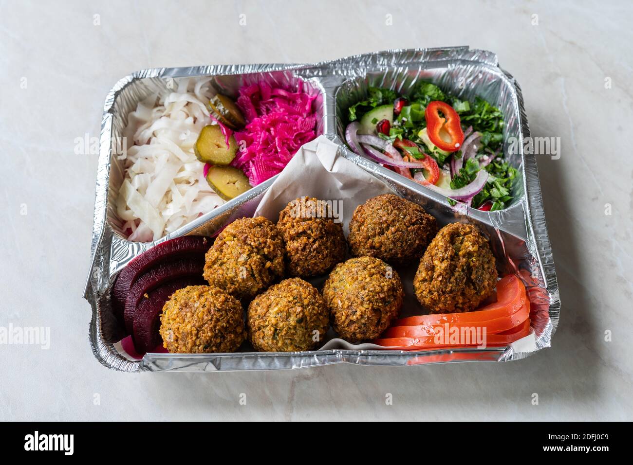 Healthy Food Restaurant Delivery Falafel with Salad. Take Away in Foil